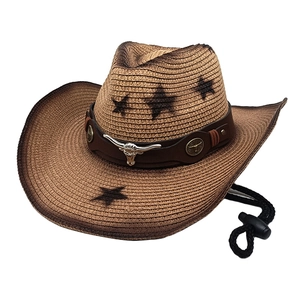 Brown woven straw cowboy hat featuring black star patterns and silver bull head ornament