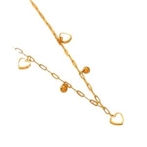Gold stainless steel necklace featuring hollow heart pendants and polished metal beads