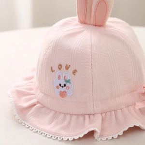 Pink knit baby sun hat featuring cute rabbit ears and embroidered love bunny design