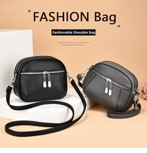 Detail view of multi-layer PU leather crossbody bags with triple zipper compartments