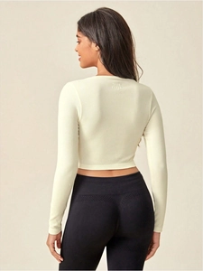 Rear view of ribbed yoga long sleeve top and high waist leggings showing lifting texture