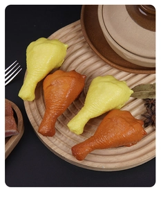 Realistic PVC chicken drumstick food models on a wooden tray with kitchen props