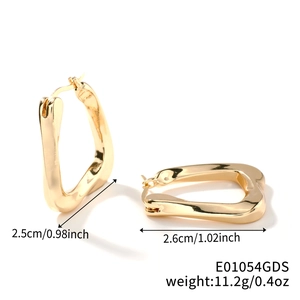 Detailed view of golden U-shaped geometric earrings with size and weight dimensions