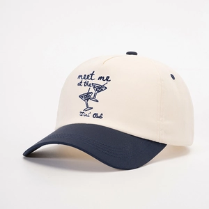 Retro two-tone baseball cap in beige and navy featuring Tini Club cocktail embroidery