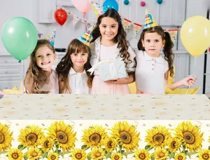 Detail of sunflower party tablecloth with floral pattern and birthday party background