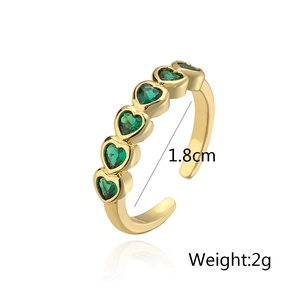 Detail of 18K gold-plated ring with five green heart-shaped zircons and adjustable band