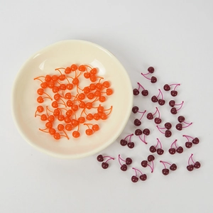 Miniature artificial twin cherry charms for DIY crafts in orange and burgundy colors