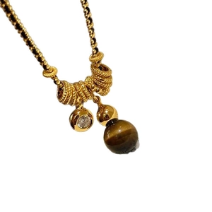 Gold plated tiger eye necklace with zircon pendant on a minimalist bead chain