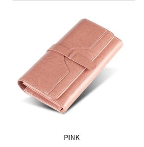 Detailed close-up of pink long wallet texture with a snap button closure and simple design