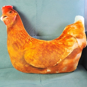 Realistic 3D printed brown hen plush pillow with vivid red crest on a blue sofa