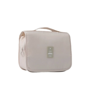 Beige hanging toiletry bag with large capacity, waterproof fabric, and travel patch