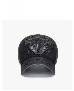 Detailed embroidery of bull skull on distressed charcoal washed cotton baseball cap