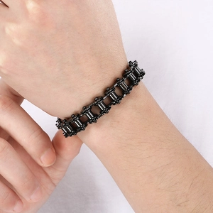 Close-up of black industrial bike chain bracelet for men in hip-hop rocker style