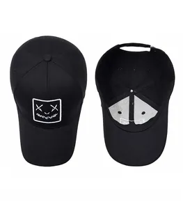 Top and interior detail of black baseball cap with smiley face embroidery and metal buckle
