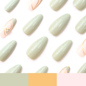 Almond press-on nails in sage green and pink with gold lines and sparkling rhinestones