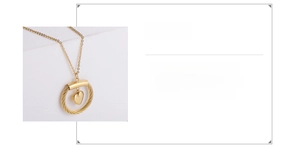 Detail view of 18K gold plated 316 stainless steel heart pendant with woven texture design