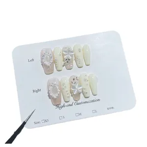 Handmade luxury press-on nails with cat-eye stones, pearls and floral metallic art