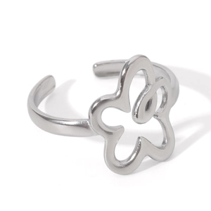 Detailed view of silver open ring featuring a hollow five-petal flower design on white background