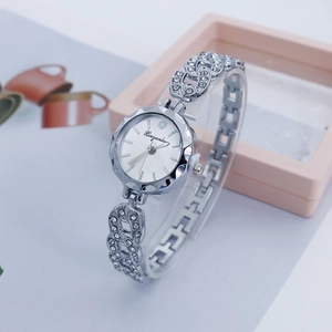 Detail of luxury silver women watch with rhinestone link bracelet and quartz dial