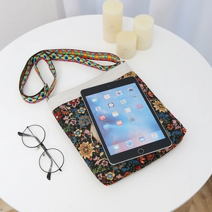 Ethnic style embroidered canvas crossbody bag with vintage floral patterns and wide strap