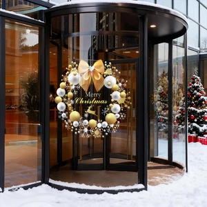 Golden Christmas wreath window sticker with Merry Christmas text on a glass mall door
