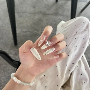 White French bow long almond press-on nails with sparkling rhinestones and art patterns