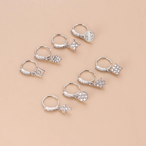 Silver nose ring set with cross pendants and zircon stones in a professional layout