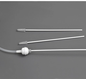 Close-up of flexible stainless steel straw brushes with durable white nylon bristles