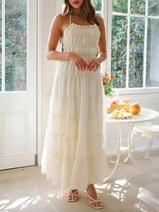 Detailed view of white multi-layered tiered halter dress with airy ruffles for summer wear