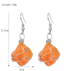 Detail view of handmade silver wire-wrapped natural raw crystal earrings showing dimensions