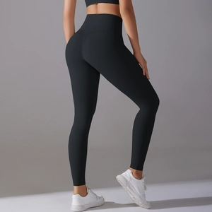 Close-up of high-waisted black yoga leggings showcasing lifting effect and matte fabric
