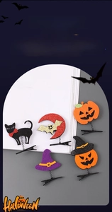Détail de barrettes d'Halloween pailletées avec citrouille, chat noir et motifs de chauve-souris