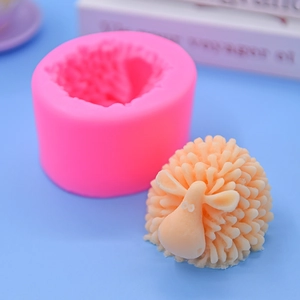 Detail of pink silicone sheep mold showing intricate texture and finished craft candle