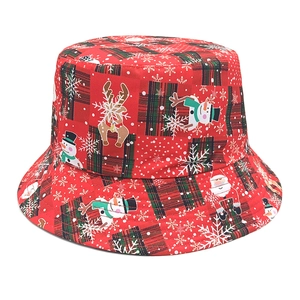 Red Christmas bucket hat with reindeer and snowman prints on a clean white background