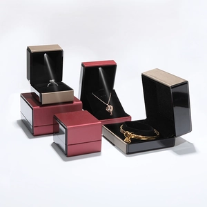 Elegant LED jewelry box set with rings and pendants in brushed leather texture