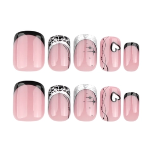 Pink Y2K press-on nails set with black French tips, silver glitter stars and heart motifs