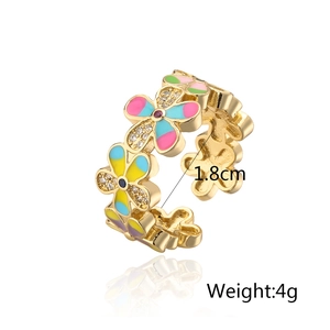 Detail view of colorful enamel flower ring with 1.8cm diameter and 4g weight specs