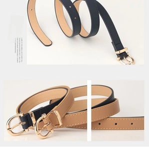 Detail of slim PU leather belts with gold oval buckles in navy and khaki tones