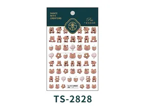 Detail view of 3D embossed nail stickers with cartoon bear, rabbit and cupcake patterns