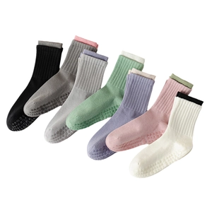 Non-slip cotton yoga socks in multiple colors with ribbed texture and silicone dots