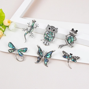 Set of 6 vintage silver animal brooches featuring colorful iridescent abalone shell inlays