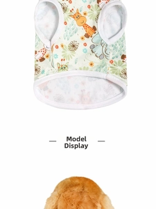 Detail view of light green dog vest with cartoon giraffe and elephant animal prints