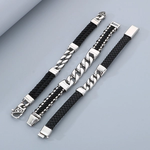 Detailed view of men's vintage leather bracelets with steel Cuban links and magnetic clasps