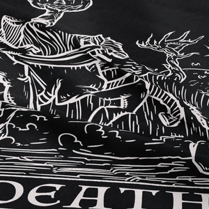 Macro detail of gothic tapestry fabric showing woodcut skull print and Death text