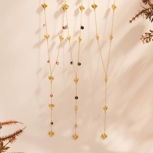 Golden Y-shaped stainless steel necklace with hollow hearts and colorful agate beads