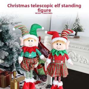 Close-up of telescopic Christmas elf dolls with tartan clothes and striped hats