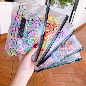 Close-up of colorful rubber loom bands in clear packaging with I CAN'T SWIM print