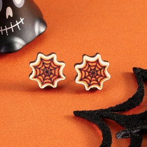 Detailed view of Halloween spider web stud earrings with a rustic wood texture finish