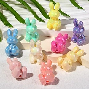 Close-up of colorful resin rabbit charms for DIY bracelets and jewelry making crafts