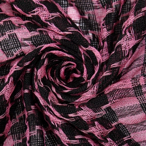 Close-up of black and pink checkered tactical scarf showing breathable mesh fabric texture